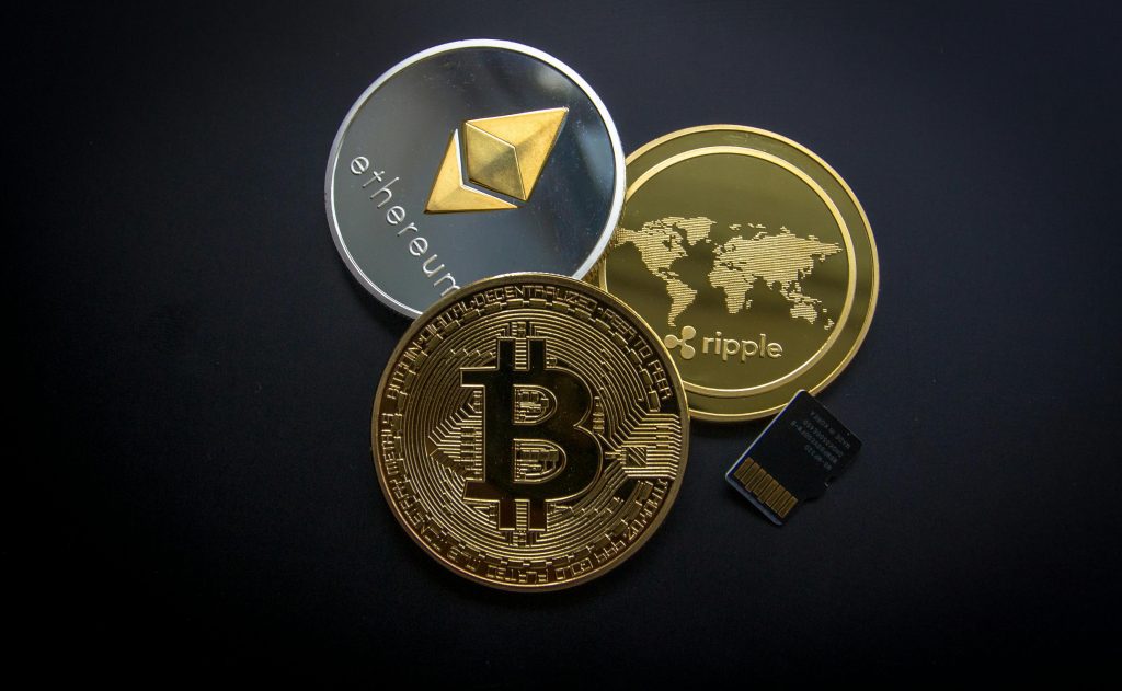 pexels photo 844124 844124 A striking image of Bitcoin, Ethereum, and Ripple coins illustrating modern digital currency.